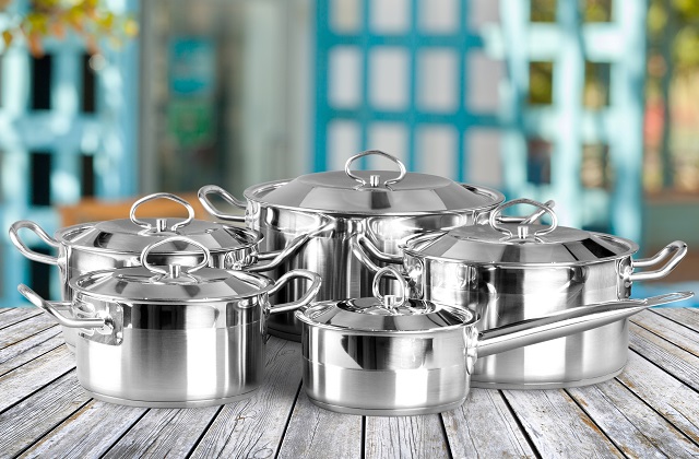 Collection of aluminum pans  on wooden table